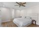 Spacious bedroom with king-size bed, ceiling fan, and wood-look flooring at 4041 Yacht Ct, Winter Park, FL 32792