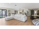 Bright and airy living room with a large sectional sofa and wood-look flooring at 4041 Yacht Ct, Winter Park, FL 32792