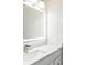 Bathroom with a vanity, sink, and illuminated mirror at 2111 Turnberry Dr, Oviedo, FL 32765