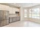 Kitchenette with stainless steel appliances and gray cabinets at 2111 Turnberry Dr, Oviedo, FL 32765