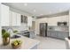 Modern kitchen with gray and white cabinets, stainless steel appliances, and quartz countertops at 2111 Turnberry Dr, Oviedo, FL 32765
