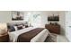 Serene bedroom with a king-size bed and two modern nightstands at 2111 Turnberry Dr, Oviedo, FL 32765