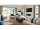Spacious living room with comfortable seating, fireplace, and large TV at 2111 Turnberry Dr, Oviedo, FL 32765