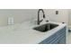 Convenient laundry room with a single sink and gray cabinets at 2111 Turnberry Dr, Oviedo, FL 32765