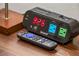 Nightstand with clock, remote, and USB ports at 1054 Lotus Cove Ct # 623, Altamonte Springs, FL 32714