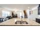 Kitchen island with granite countertop and double sink overlooking living room at 3556 Cheswick Dr, Ocoee, FL 34761