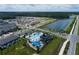 Aerial view showing community pool and surrounding townhomes at 5043 Prairie Preserve Run, St Cloud, FL 34772
