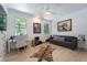 Home office with a desk, couch, and hardwood floors at 11113 Lake Butler Blvd, Windermere, FL 34786