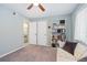 Relaxing bedroom with built-in shelving and access to bathroom at 466 Bouchelle Dr # 202, New Smyrna Beach, FL 32169