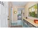 Bright condo entryway with decorative art and console table at 466 Bouchelle Dr # 202, New Smyrna Beach, FL 32169