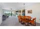 Spacious living room with comfy seating and access to a balcony overlooking nature at 466 Bouchelle Dr # 202, New Smyrna Beach, FL 32169
