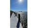 Scenic boardwalk offering tranquil waterfront views at 466 Bouchelle Dr # 202, New Smyrna Beach, FL 32169