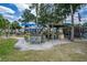 Community outdoor kitchen and bar area with seating at 466 Bouchelle Dr # 202, New Smyrna Beach, FL 32169