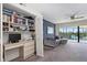 Convenient home office with built-in shelving and a workspace at 466 Bouchelle Dr # 202, New Smyrna Beach, FL 32169