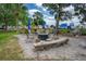 Relaxing outdoor fire pit area with seating and landscaping at 466 Bouchelle Dr # 202, New Smyrna Beach, FL 32169
