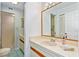 Updated bathroom with a large vanity and shower at 466 Bouchelle Dr # 202, New Smyrna Beach, FL 32169