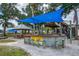 Community outdoor bar with seating and shade structure at 466 Bouchelle Dr # 202, New Smyrna Beach, FL 32169
