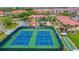 Community tennis and shuffleboard courts at 466 Bouchelle Dr # 202, New Smyrna Beach, FL 32169