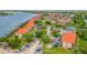Aerial view of community showing buildings, landscaping and waterfront access at 466 Bouchelle Dr # 202, New Smyrna Beach, FL 32169