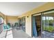 Private balcony with outdoor seating and scenic views at 466 Bouchelle Dr # 202, New Smyrna Beach, FL 32169