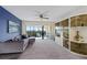 Living room with sectional sofa, large windows and access to balcony at 466 Bouchelle Dr # 202, New Smyrna Beach, FL 32169