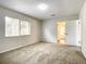 Bright bedroom with neutral walls, carpet flooring, and sliding door access at 3130 Willow Oak Dr, Edgewater, FL 32141