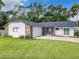 Newly renovated single-story home with stone accents and a two-car garage at 3130 Willow Oak Dr, Edgewater, FL 32141