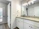 Updated bathroom with granite countertops and white cabinets at 3130 Willow Oak Dr, Edgewater, FL 32141