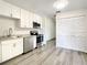 Updated kitchen, featuring white shaker cabinets and stainless steel appliances at 3130 Willow Oak Dr, Edgewater, FL 32141