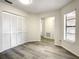 Spacious bedroom with wood-look floors and large closet at 3130 Willow Oak Dr, Edgewater, FL 32141