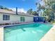 Inviting pool area with lanai, lush landscaping, and ample space for relaxation at 3130 Willow Oak Dr, Edgewater, FL 32141