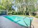 Relaxing pool area with a screened enclosure and lush landscaping at 3130 Willow Oak Dr, Edgewater, FL 32141