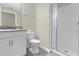 Clean bathroom with shower, toilet and vanity at 770 Pebble Beach Dr, Davenport, FL 33896