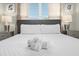Comfortable main bedroom with a king-size bed and neutral decor at 770 Pebble Beach Dr, Davenport, FL 33896