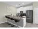 Modern kitchen with stainless steel appliances at 770 Pebble Beach Dr, Davenport, FL 33896