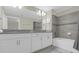 Bathroom with double vanity and bathtub at 770 Pebble Beach Dr, Davenport, FL 33896