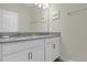 Double vanity bathroom with gray countertop at 770 Pebble Beach Dr, Davenport, FL 33896