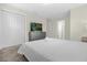 Comfortable bedroom with a queen-size bed and built-in dresser at 770 Pebble Beach Dr, Davenport, FL 33896