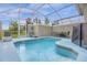 Relaxing screened-in pool and patio area at 770 Pebble Beach Dr, Davenport, FL 33896