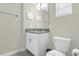 Clean bathroom with single vanity and toilet at 770 Pebble Beach Dr, Davenport, FL 33896