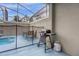 Private screened pool area with patio furniture and grill at 770 Pebble Beach Dr, Davenport, FL 33896