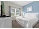 King-size bed in bright bedroom with large window at 770 Pebble Beach Dr, Kissimmee, FL 34747