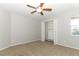 Spacious bedroom with ceiling fan and built-in closet at 259 New Waterford Pl, Longwood, FL 32779