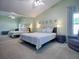 Main bedroom with large mirror and ceiling fan at 259 New Waterford Pl, Longwood, FL 32779