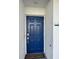 Inviting blue front door entryway with a welcome mat at 3131 Paradox Cir # 206, Kissimmee, FL 34746