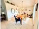 Dining area with wood table and chairs at 2555 Oneida Loop, Kissimmee, FL 34747