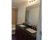 Bathroom with double vanity and large mirror at 776 E Broadway St, Oviedo, FL 32765