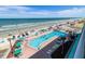 Oceanfront pool and deck with ample seating and beach access at 701 S Atlantic Ave # 508, Daytona Beach, FL 32118