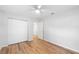 Spacious bedroom with large closet and wood-look flooring at 3202 Montclair Rd, Orlando, FL 32806