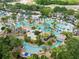 Large resort-style pool complex with lazy river and multiple lounging areas at 1360 Centre Court Ridge Dr # 201, Reunion, FL 34747